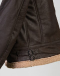 Genuine leather bomber jacket with shearling details and interior.